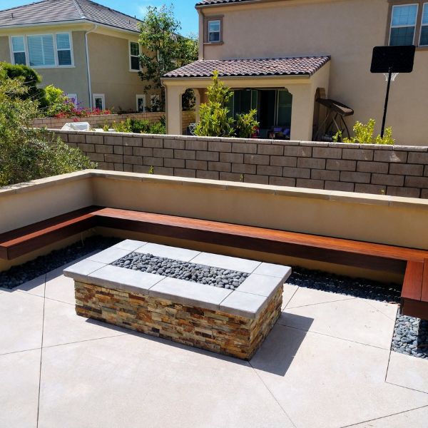 Renovated backyard fire pit space done by Wilson Woodscape